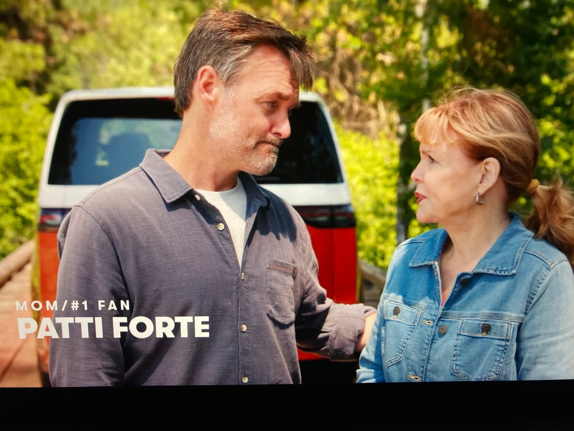Will Forte talking with his mom Patti beside the red van